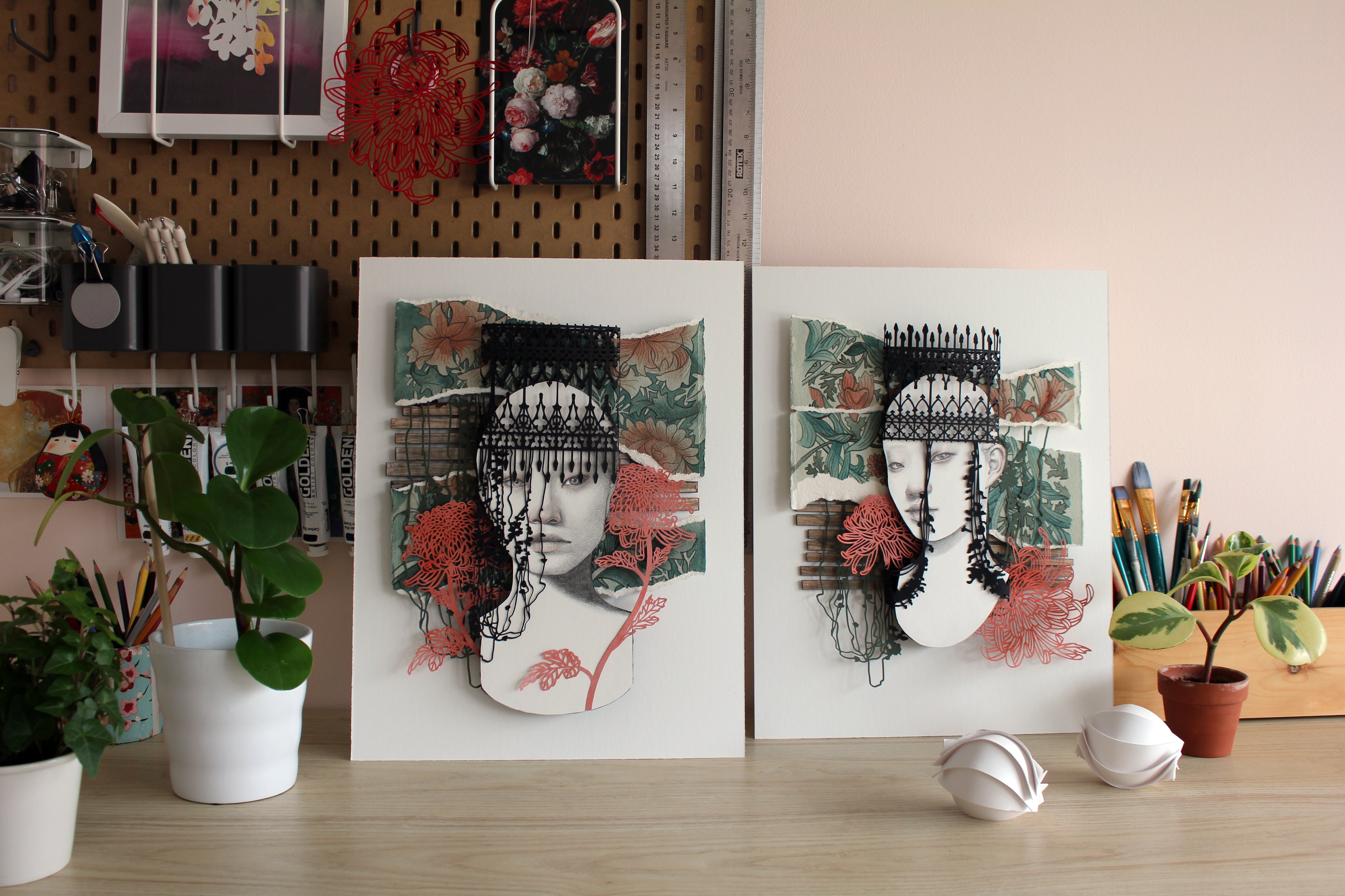 Two artistic portraits of a woman with a crown on a desk with plants and stationery by Christine Kim