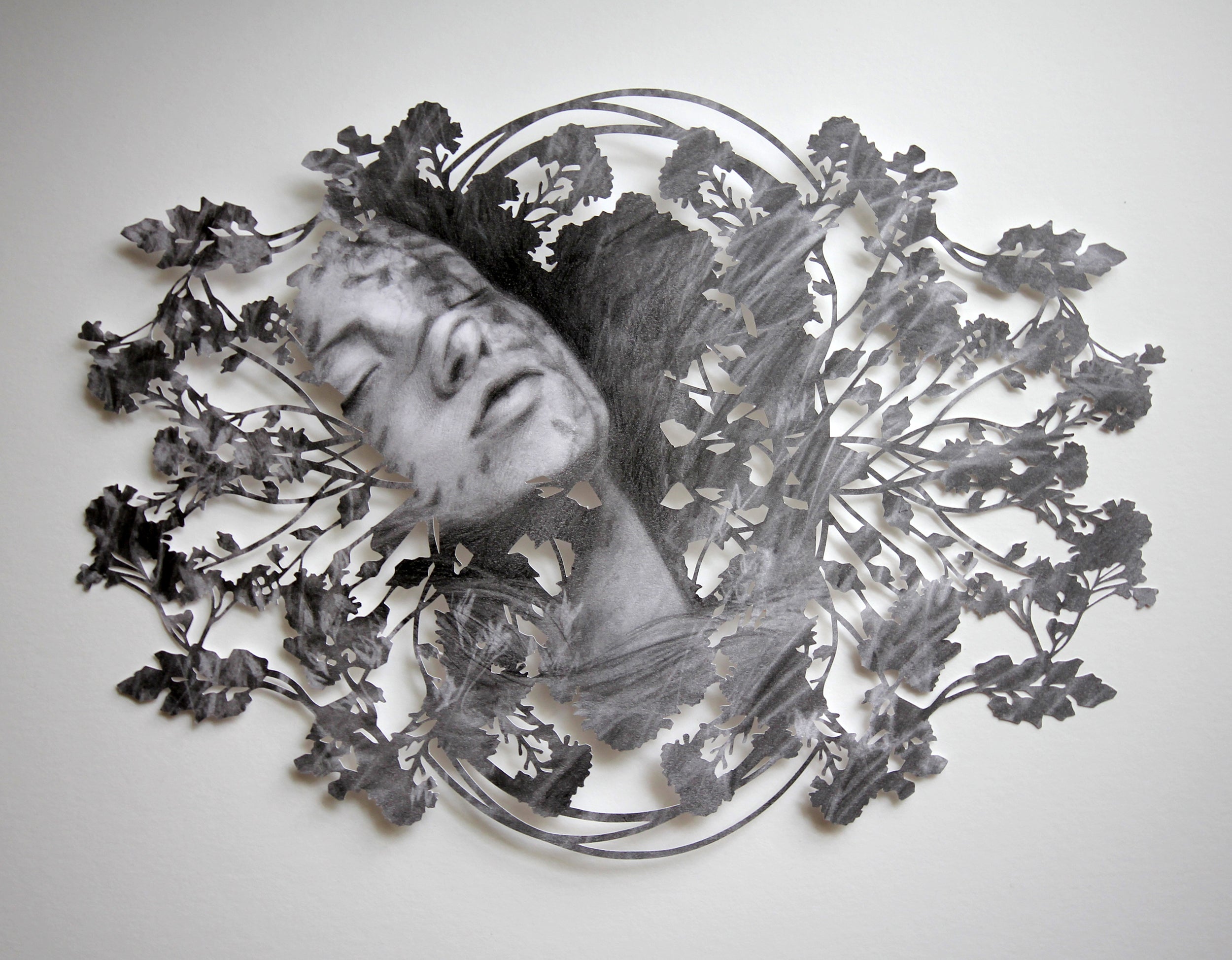 Slumber by Christine Kim – Artistic depiction of a face surrounded by floral patterns on a white background