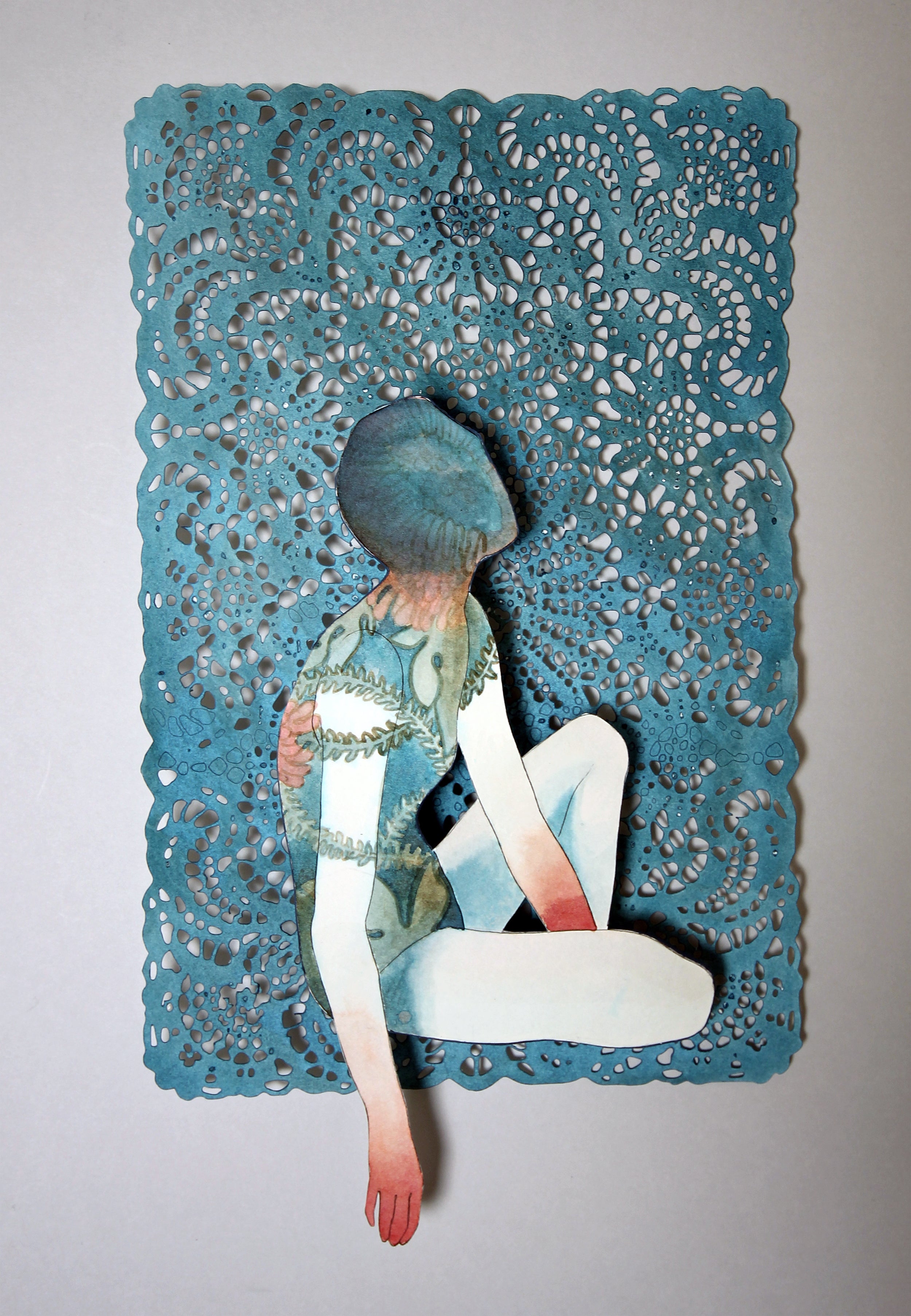 Unravelling by Christine Kim – Collage of a person sitting on a textured blue lace background original cut paper artwork