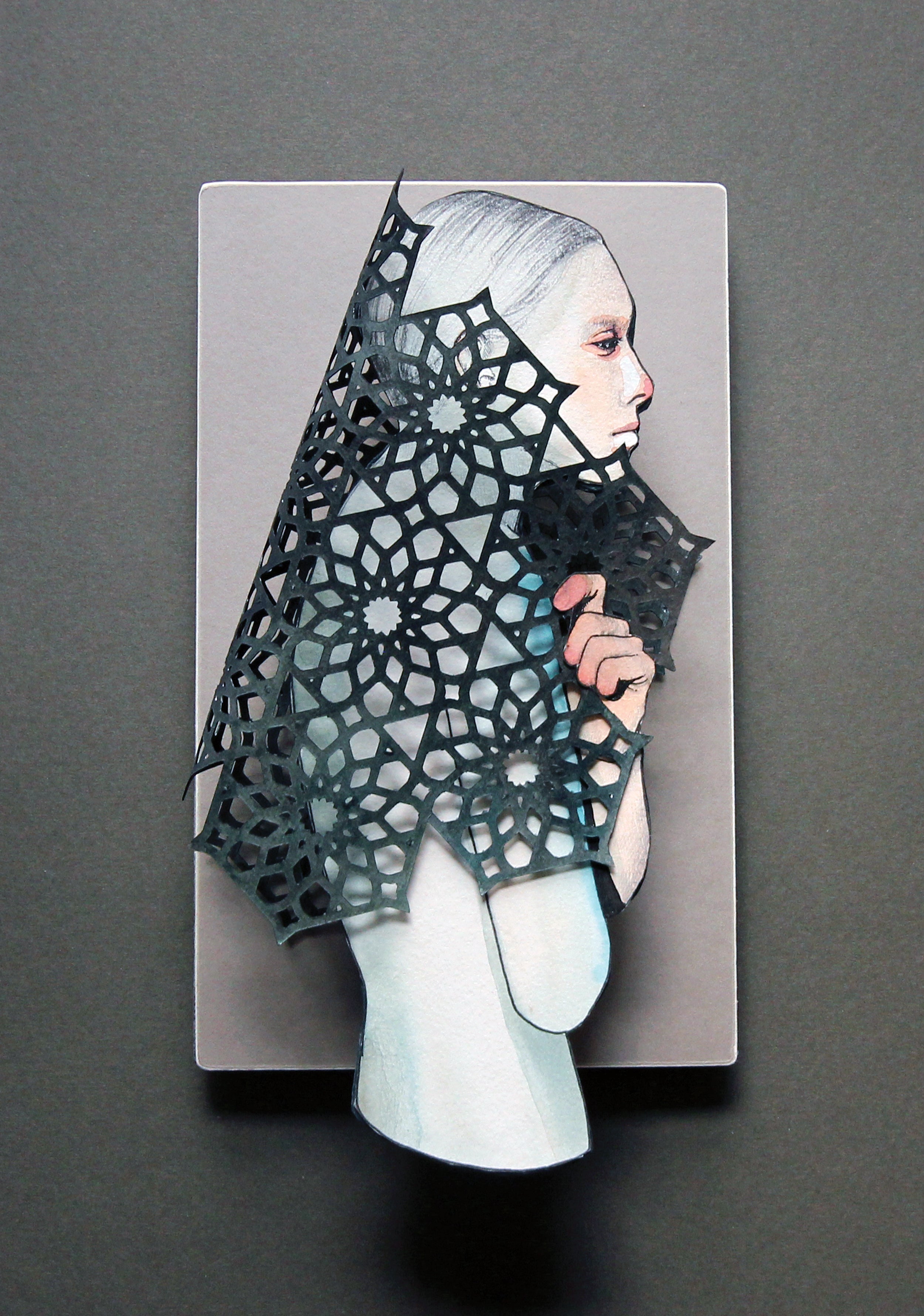 Mannequin wearing a black lace shawl on a gray background original cut paper artwork by Christine Kim